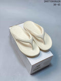 Pair of off-white New Balance flip-flop sandals displayed on a branded shoe box; image text shows product code 2607YD936A26 and size range 36–45.