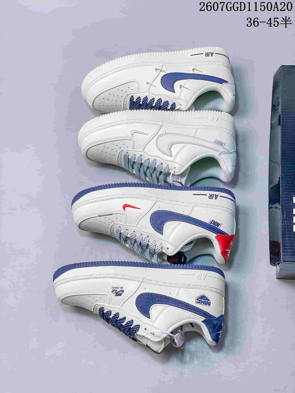 Several white Nike low-top sneakers arranged to show side profiles and different blue, gray, and red accent treatments.