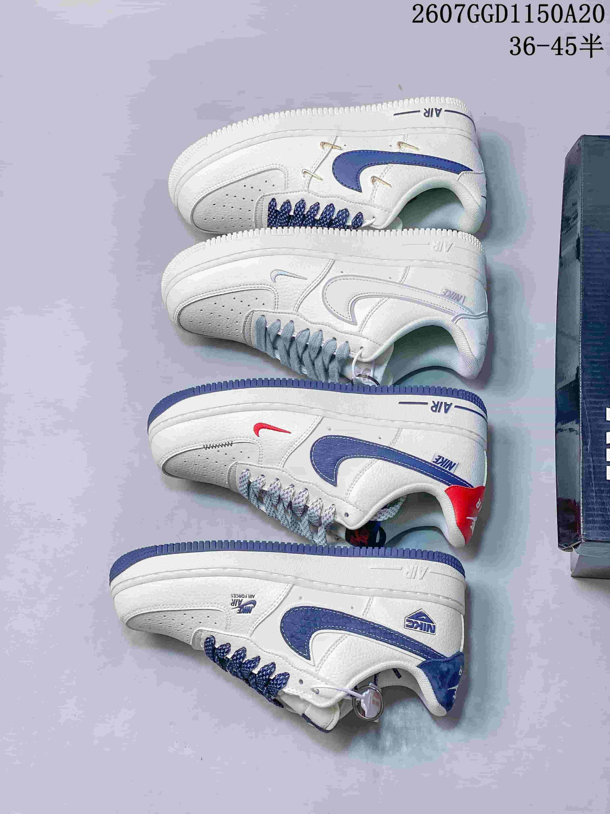 Several white Nike low-top sneakers arranged to show side profiles and different blue, gray, and red accent treatments.