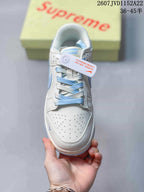 Top view showing the perforated white toe box, dual-tone laces, and tongue branding.