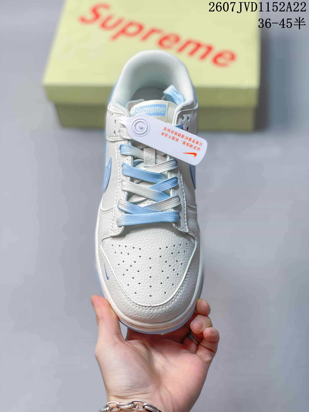 Top view showing the perforated white toe box, dual-tone laces, and tongue branding.