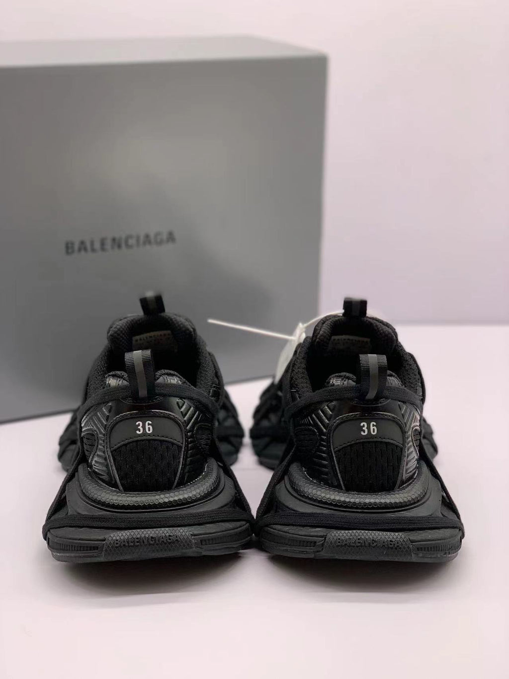 Rear view of the sneakers with size 36 visibly marked on both heel panels.
