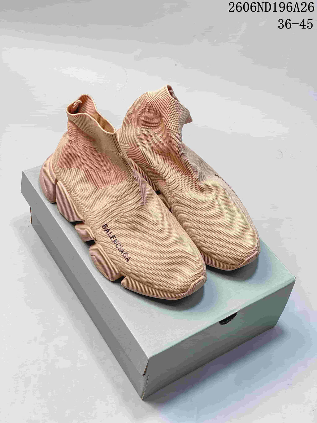 Pair of beige Balenciaga knit sock sneakers displayed on a shoebox; style code 2606ND196A26 and size range 36-45 are visible.