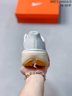 Rear view of the sneaker showing the padded heel collar, textured upper, and visible ReactX marking on the midsole.