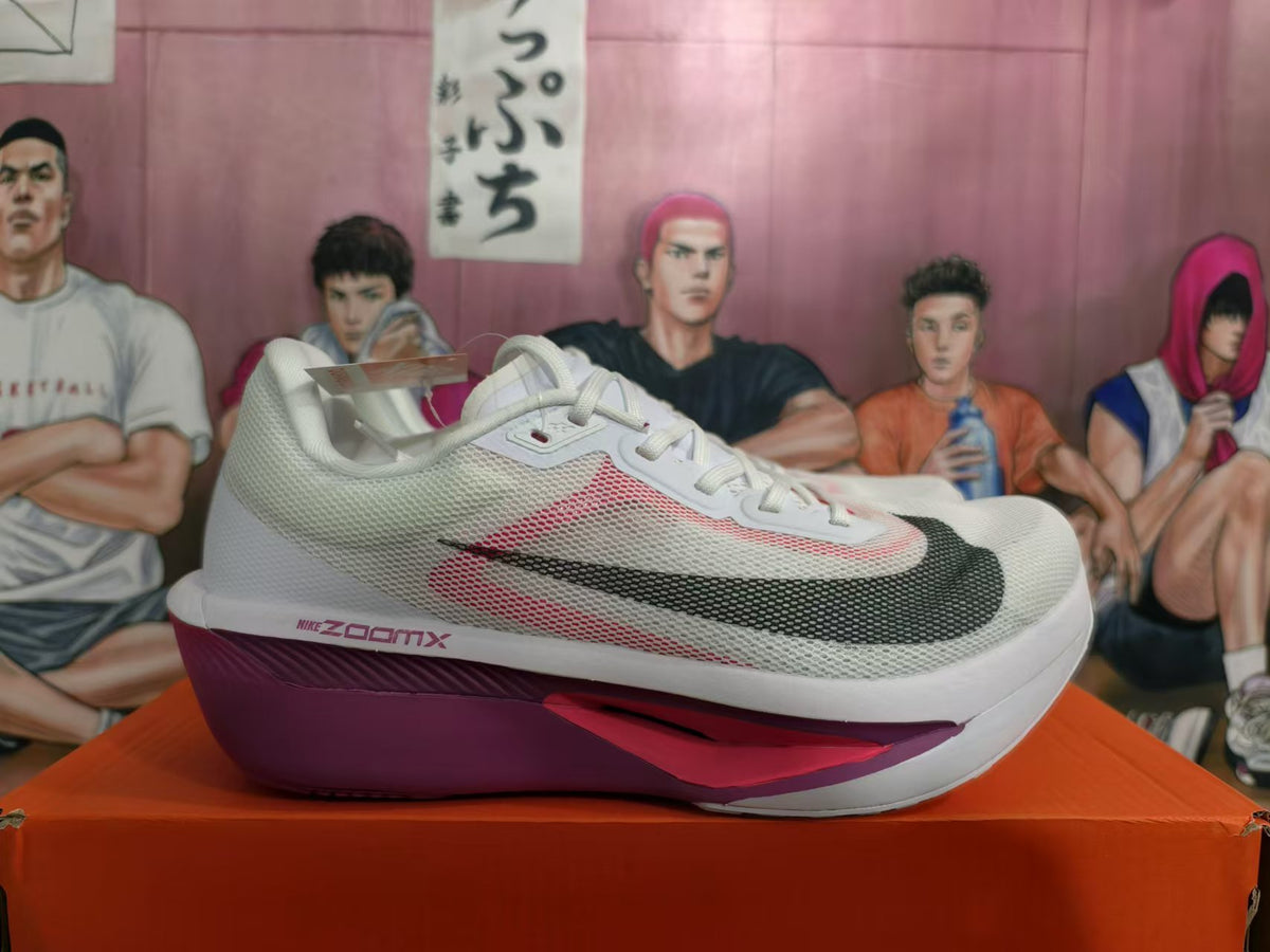 Side view of a white Nike running shoe with pink accents, dark Swoosh, and purple-toned sole