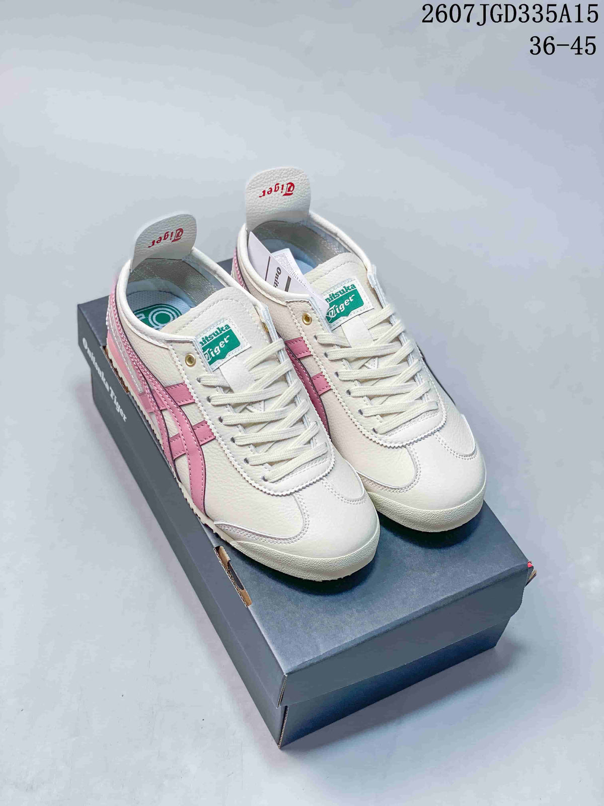Pair of white and pink Onitsuka Tiger Mexico 66 Deluxe sneakers displayed on a shoe box from a front three-quarter angle; image text shows style code 2607JGD335A15 and size range 36–45.