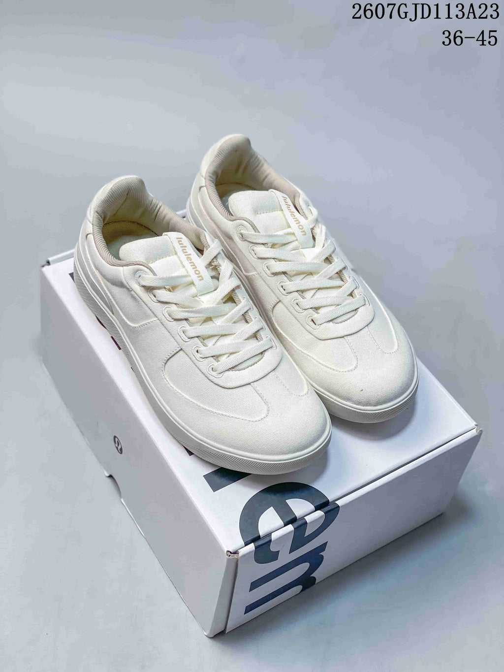 Pair of white lululemon Cityverse low-top sneakers displayed on a branded shoebox; image text shows style code 2607GJD113A23 and size range 36–45.