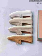 Side profiles of loafers shown in several pale neutral and tan colors
