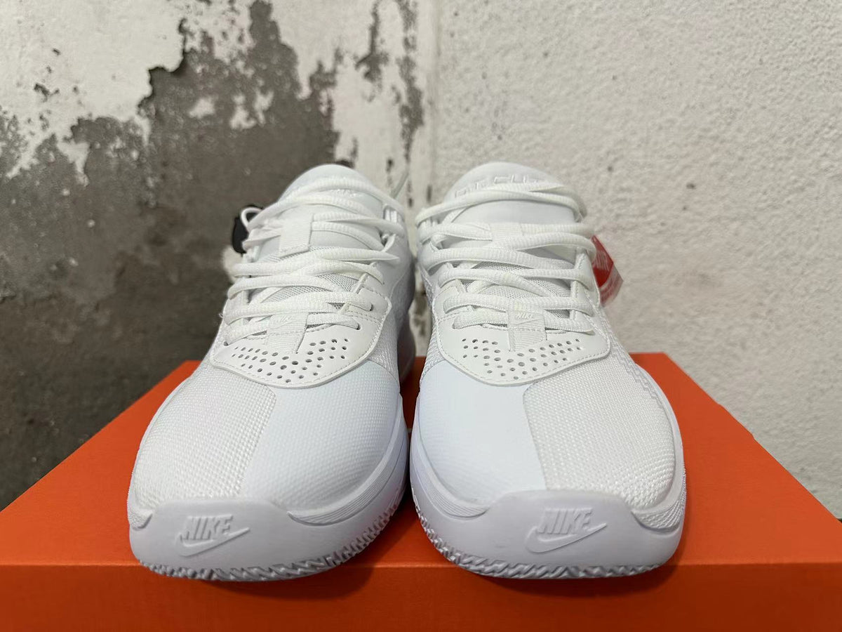 Front view of white Nike G.T. Cut Academy basketball shoes showing laces and perforated panels