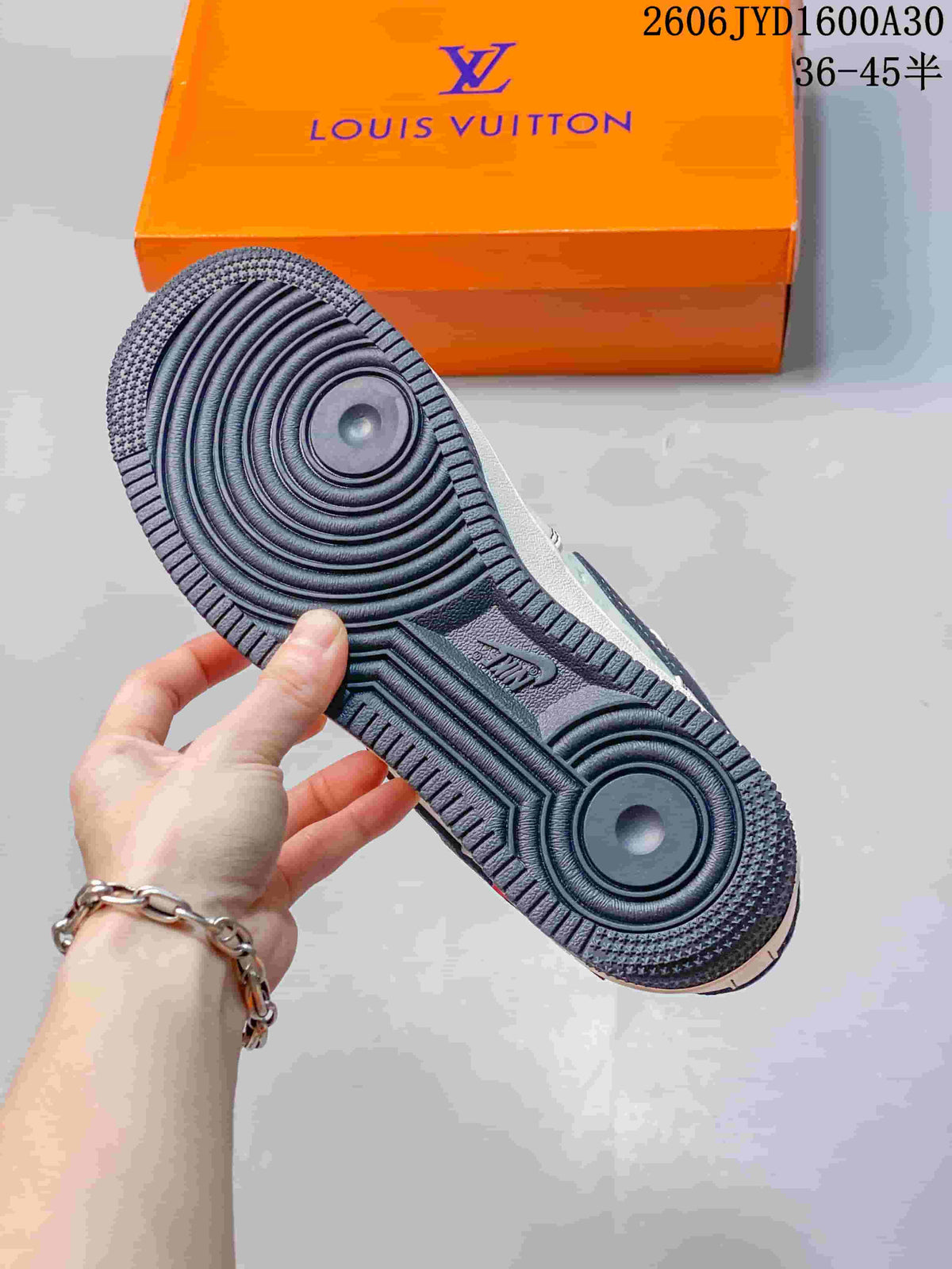 Close-up of the dark circular-pattern rubber outsole