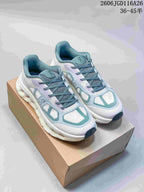 Pair of white On Cloudtilt Remix sneakers with teal accents and sculpted soles.