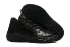 All-black high-top basketball shoes with graphic side detailing and sculpted soles.
