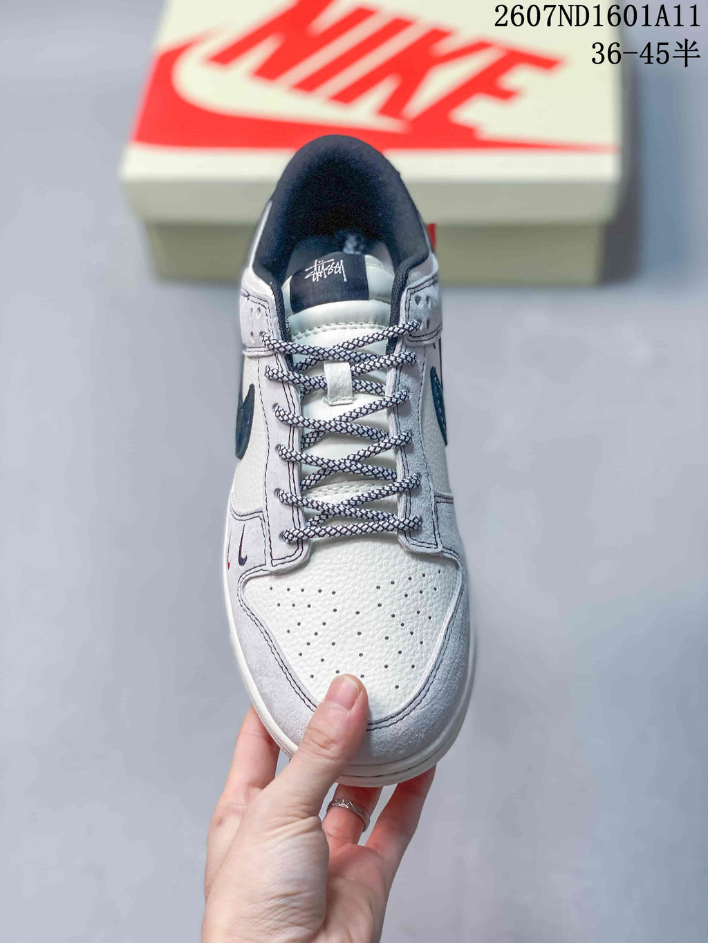 Top view of the sneaker showing patterned laces, perforated toe box, padded collar, and tongue branding.