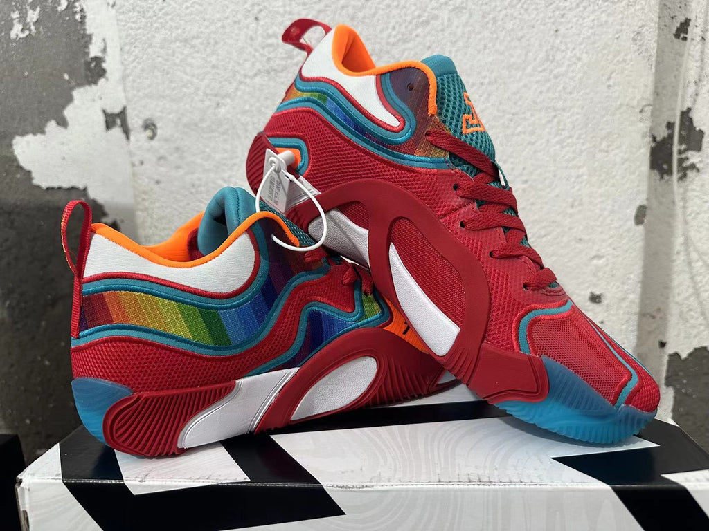 Pair of red, blue and multicolor Jordan basketball shoes shown from the side.