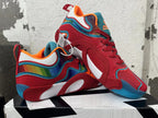 Pair of red, blue and multicolor Jordan basketball shoes shown from the side.