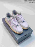 Pair of lavender and grey patterned Nike Air Force 1 low-top sneakers