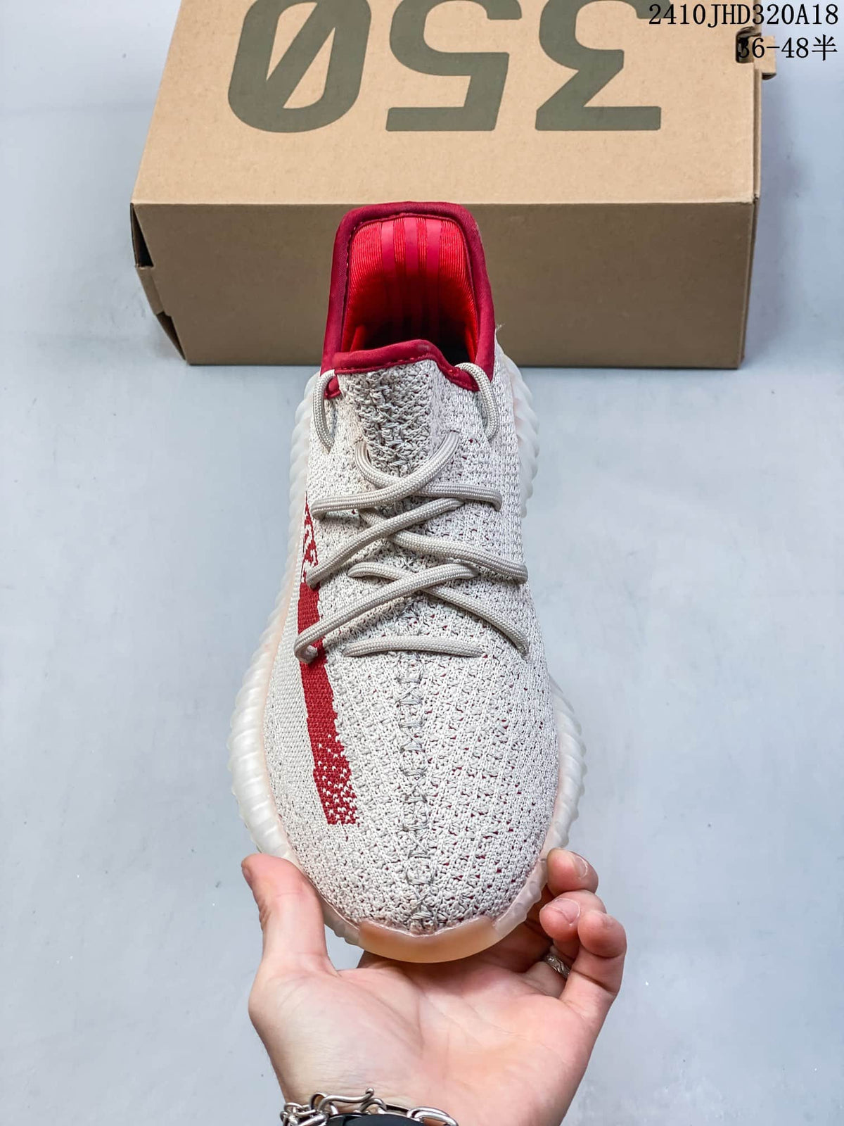 Front view showing the knit toe, laces, and red collar lining.