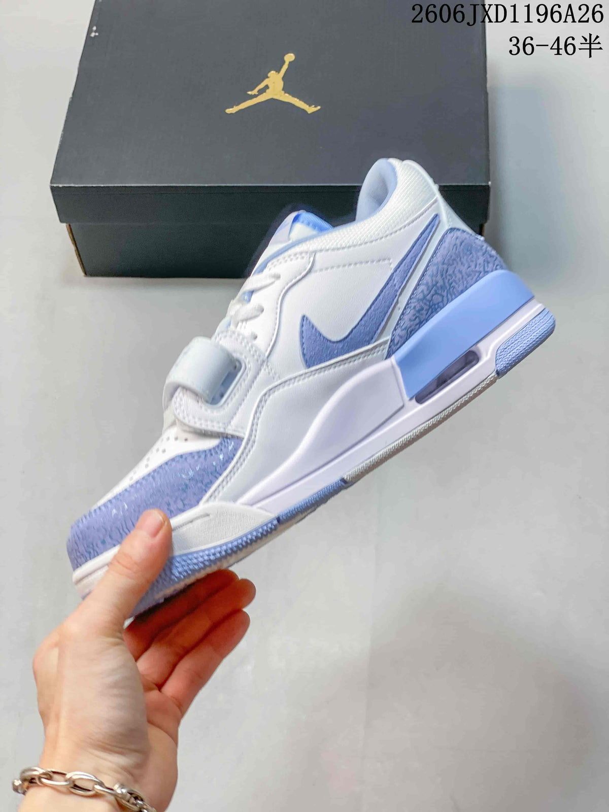 Side view of the white and blue Air Jordan Legacy 312 Low sneaker