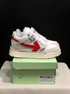 Side view of a white sneaker with a large red arrow-shaped accent and textured outsole.
