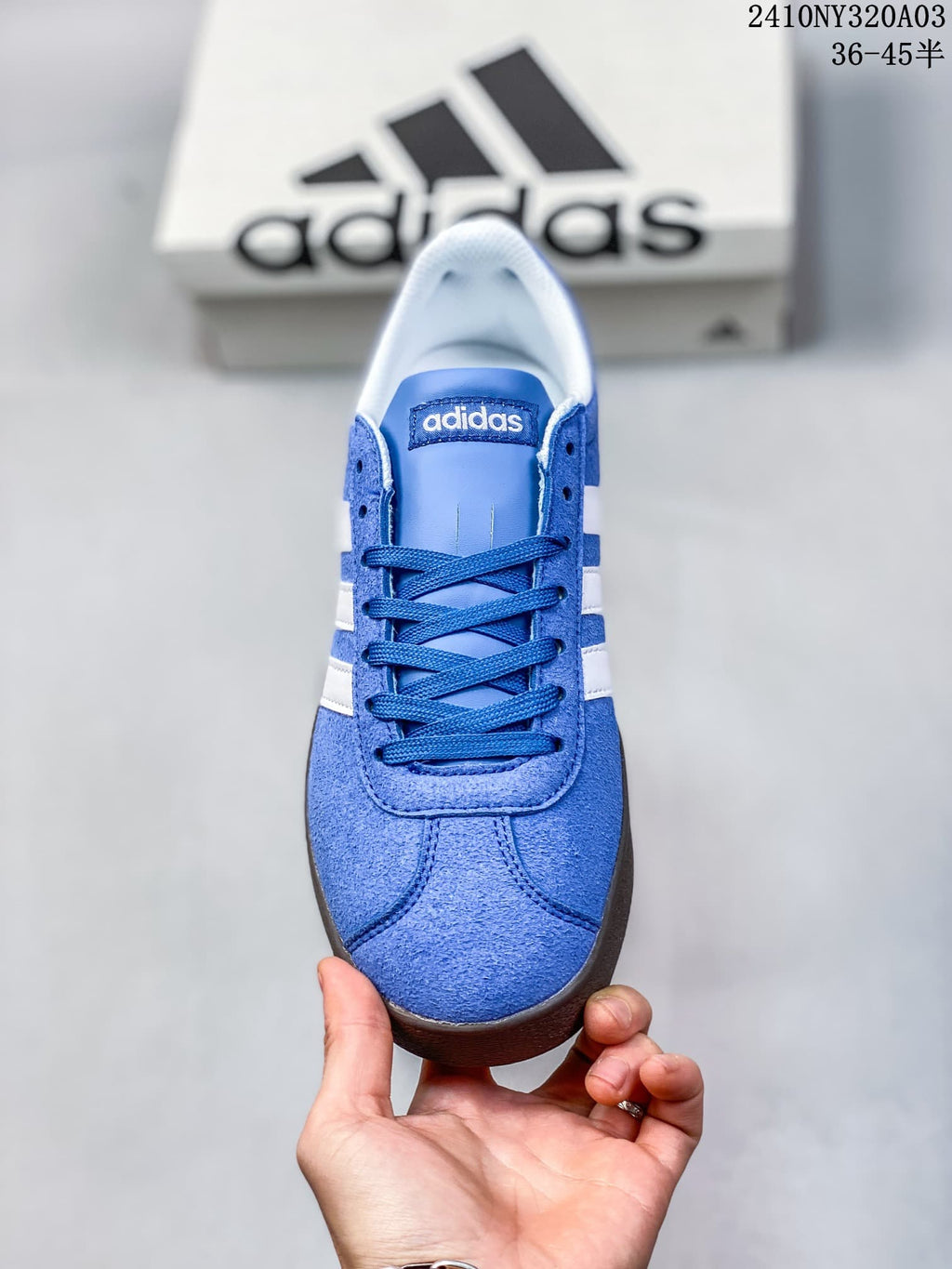 Top-down view showing the blue laces, tongue and white interior lining.