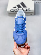 Top-down view showing the blue laces, tongue and white interior lining.