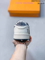 Rear view showing the white heel, dark outsole edge, and Jordan-related heel branding.