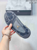 Close-up of the patterned dark outsole with a Jordan emblem in the center.