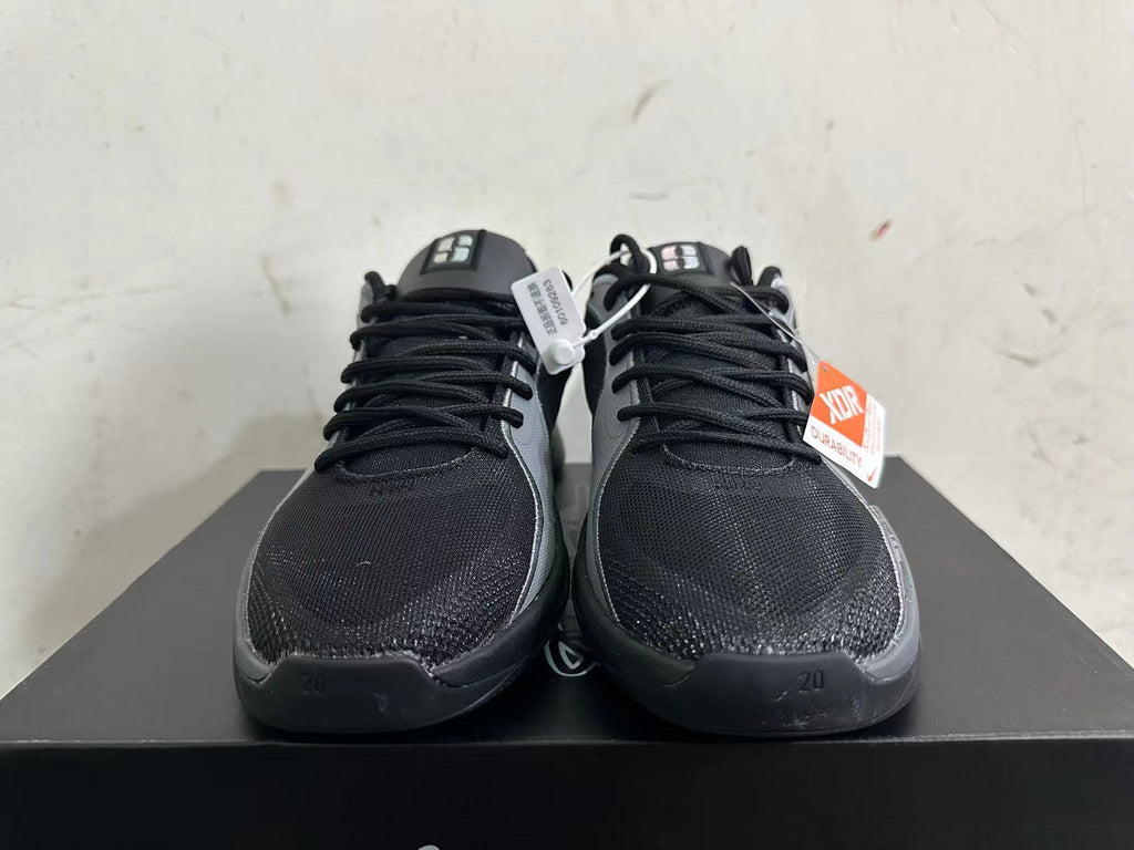 Front view showing black uppers, grey trim, and lace-up closures