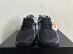Front view showing black uppers, grey trim, and lace-up closures