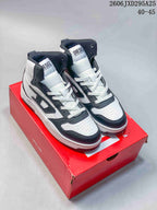 Pair of white and dark gray Diesel S-Ukiyo high-top sneakers on a red shoebox