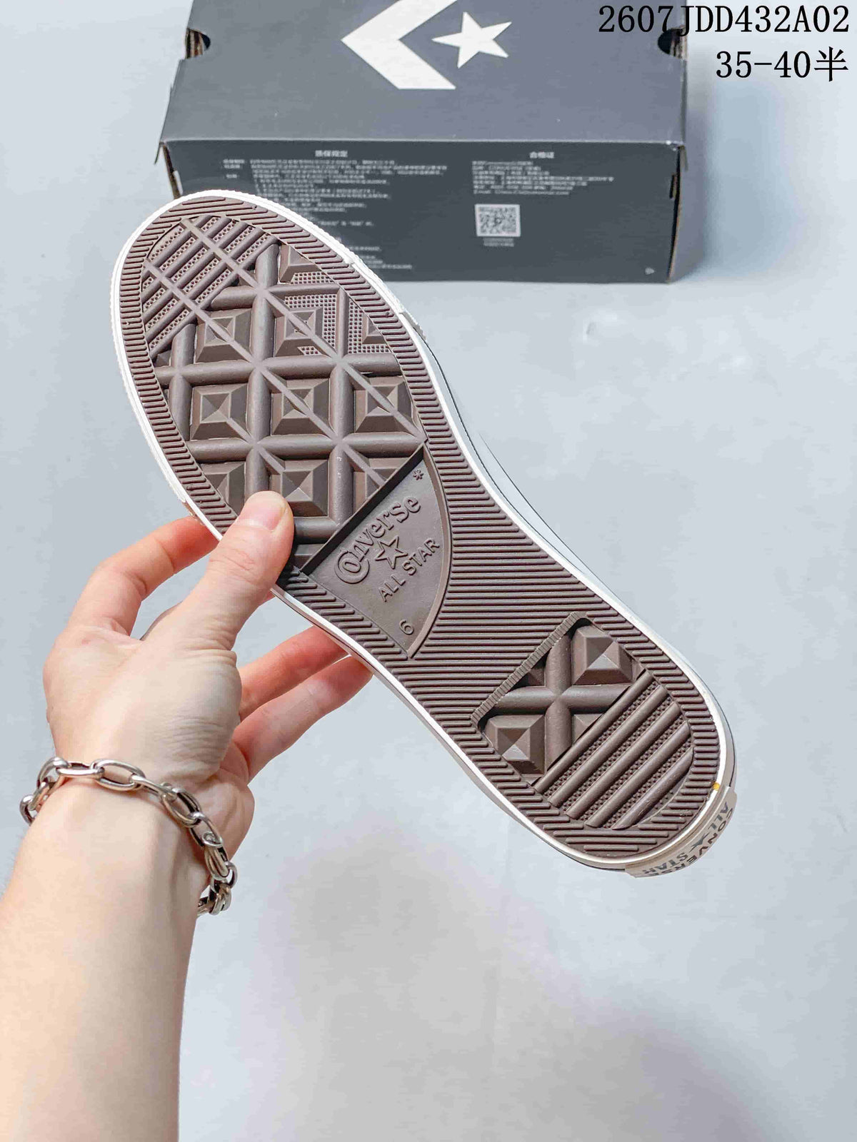 Outsole of a Converse All Star Lift sneaker showing the patterned tread and branded center panel.