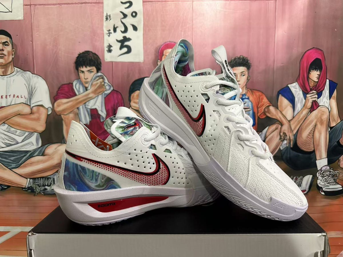 Angled view of a pair of white Nike basketball sneakers displaying the side Swoosh, textured outsole and multicolor camouflage-style detailing.