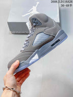 Side profile of a grey Jordan Air Jordan 5 with perforated side panels