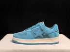 Side profile of a light blue BAPE STA sneaker showing the star-shaped side detail, padded collar, off-white midsole, and blue outsole.