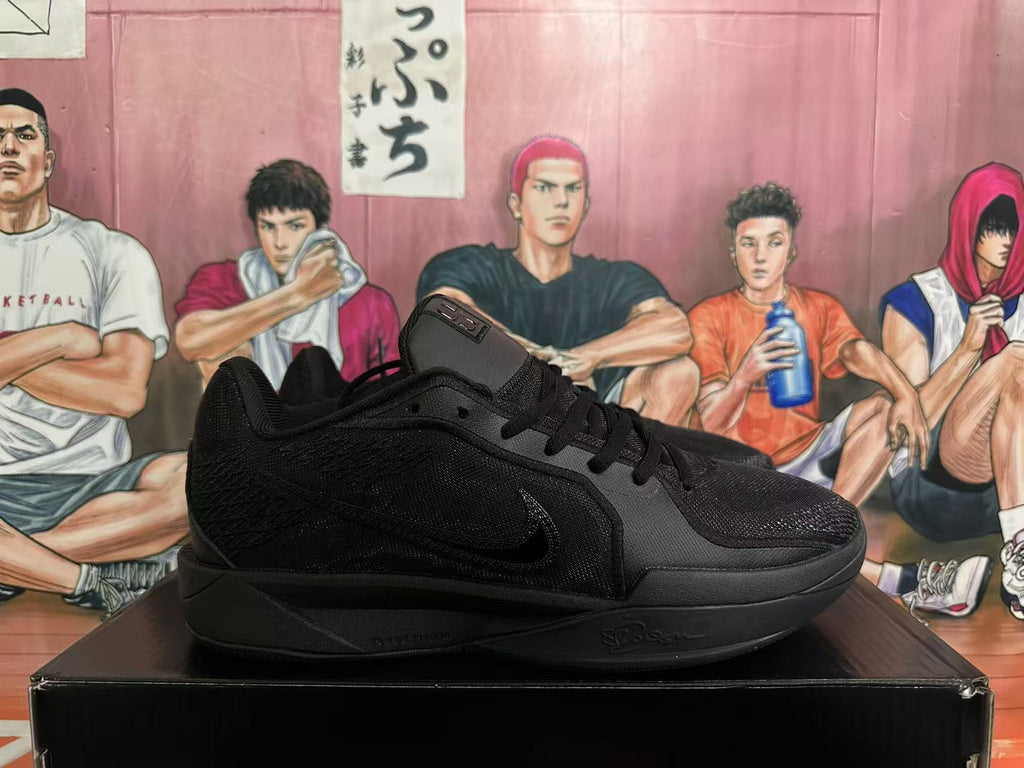 Side profile of a black low-cut basketball shoe with Swoosh branding