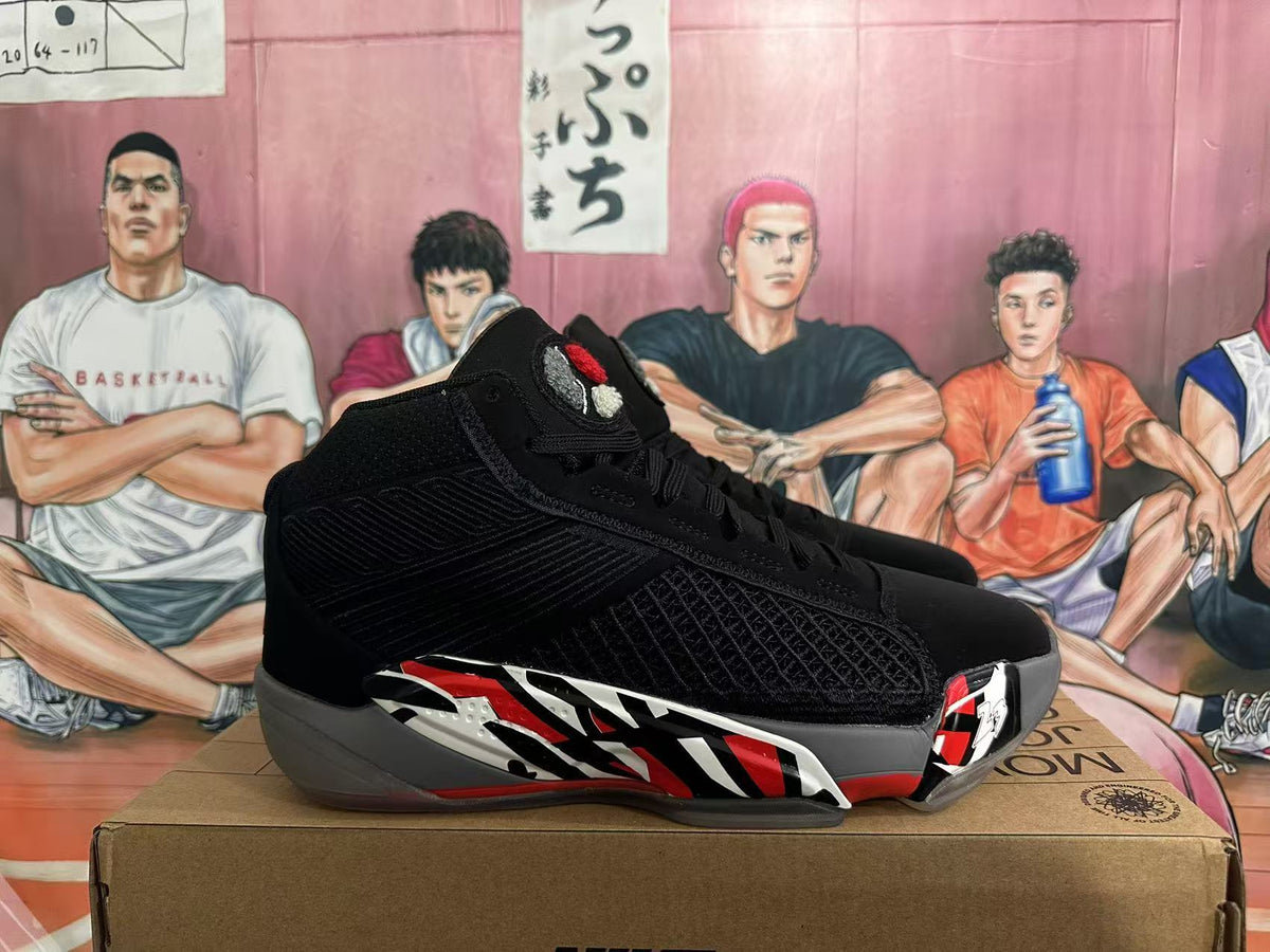 Side profile of a black Jordan 23 high-top sneaker with red, white, and gray graphic accents.