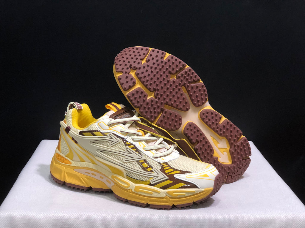 Three-quarter view showing the sneaker uppers and the brown outsole tread pattern.