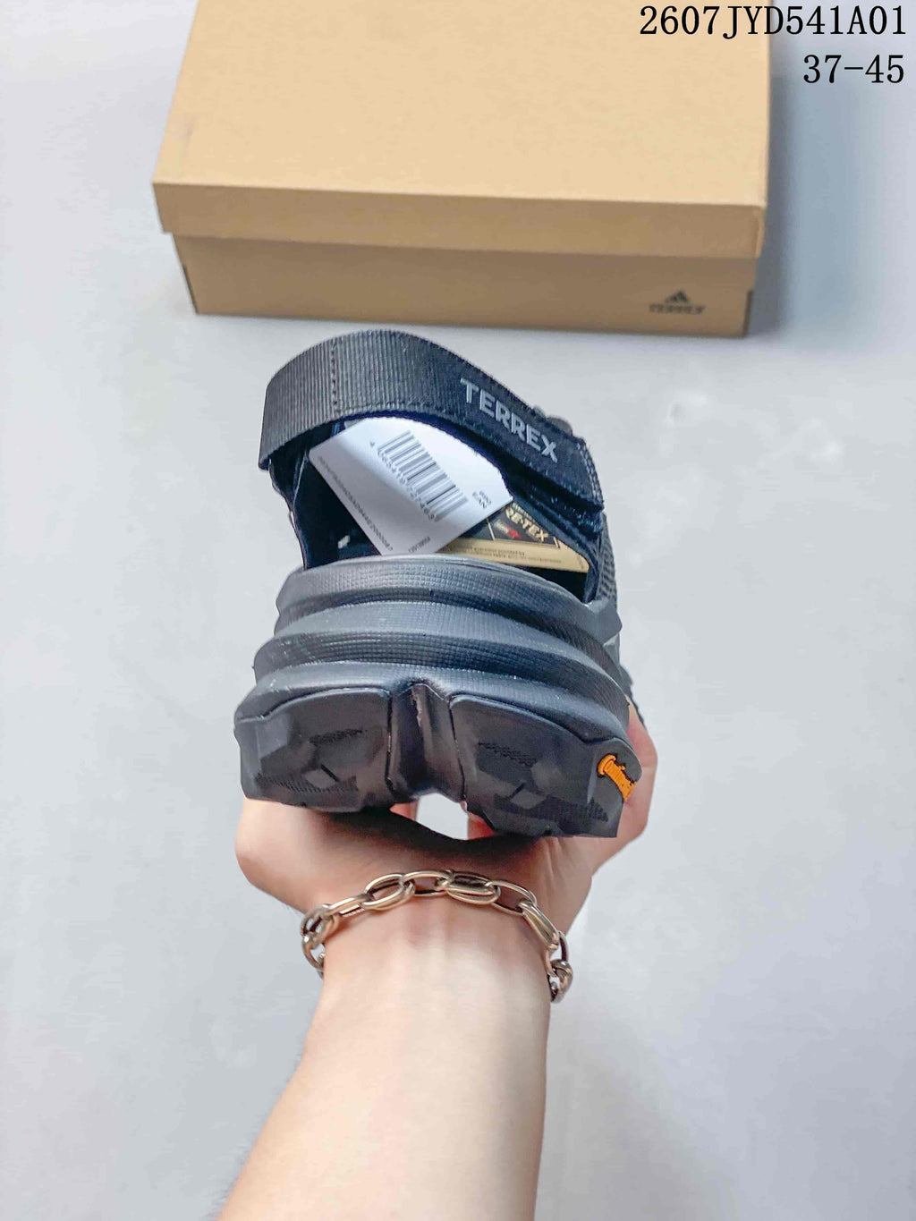Rear view showing the heel and strap detail of a dark gray Terrex shoe