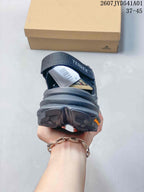 Rear view showing the heel and strap detail of a dark gray Terrex shoe