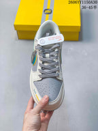 Top view showing gray laces, a perforated gray toe panel, and white overlays.