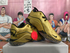 Pair of metallic gold Nike basketball shoes with black detailing and spotted outsoles