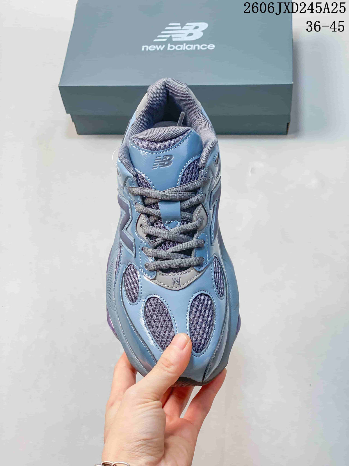 Top view of a blue and gray lace-up sneaker with mesh panels