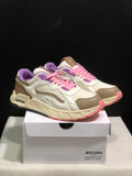 Pair of white, beige, pink, and purple low-top sneakers displayed on a shoe box; the box label shows size 41.