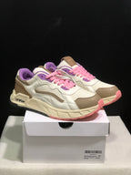 Pair of white, beige, pink, and purple low-top sneakers displayed on a shoe box; the box label shows size 41.