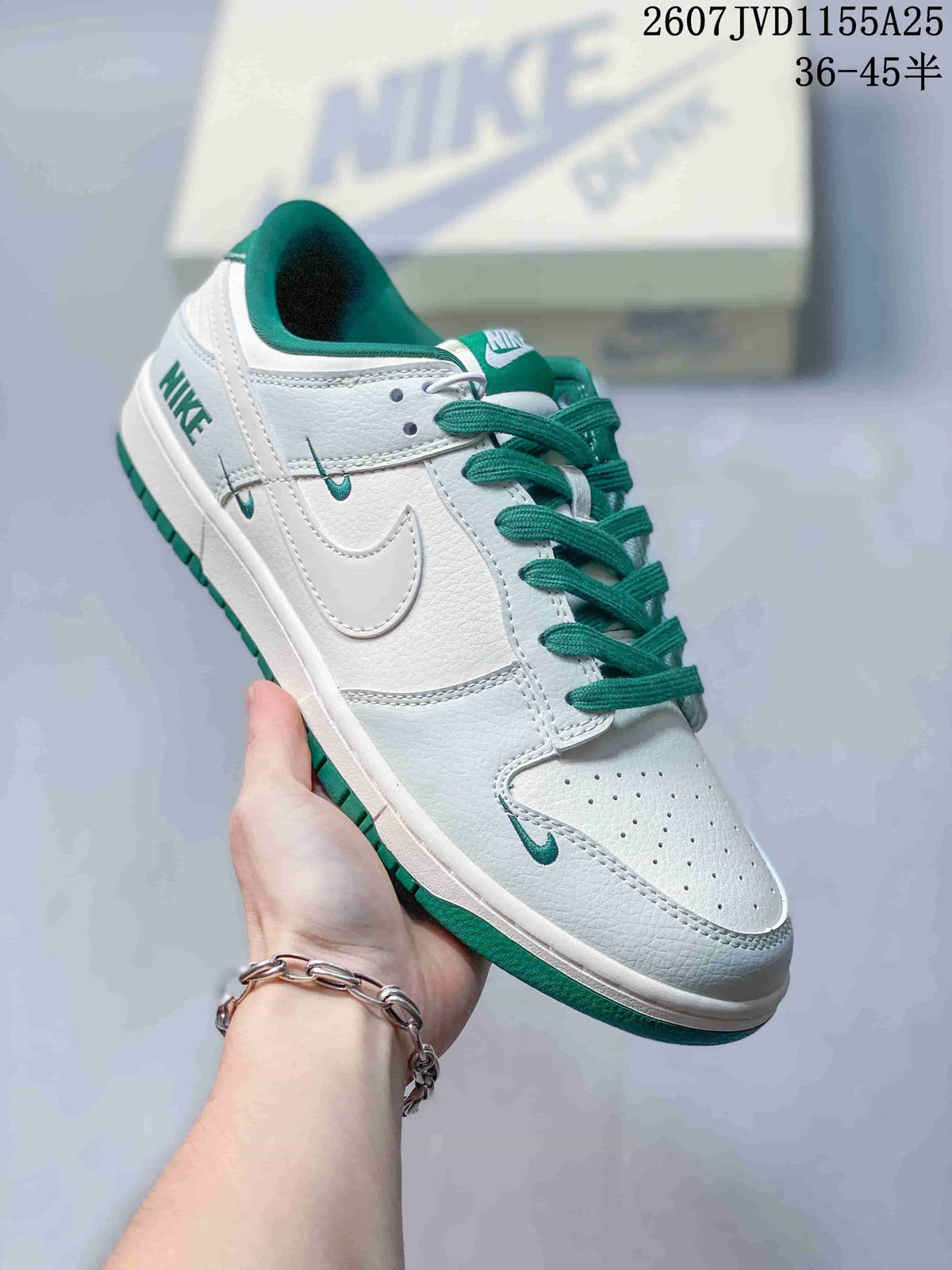 Angled side view showing the white and green colorway, Swoosh branding, and low-top silhouette.