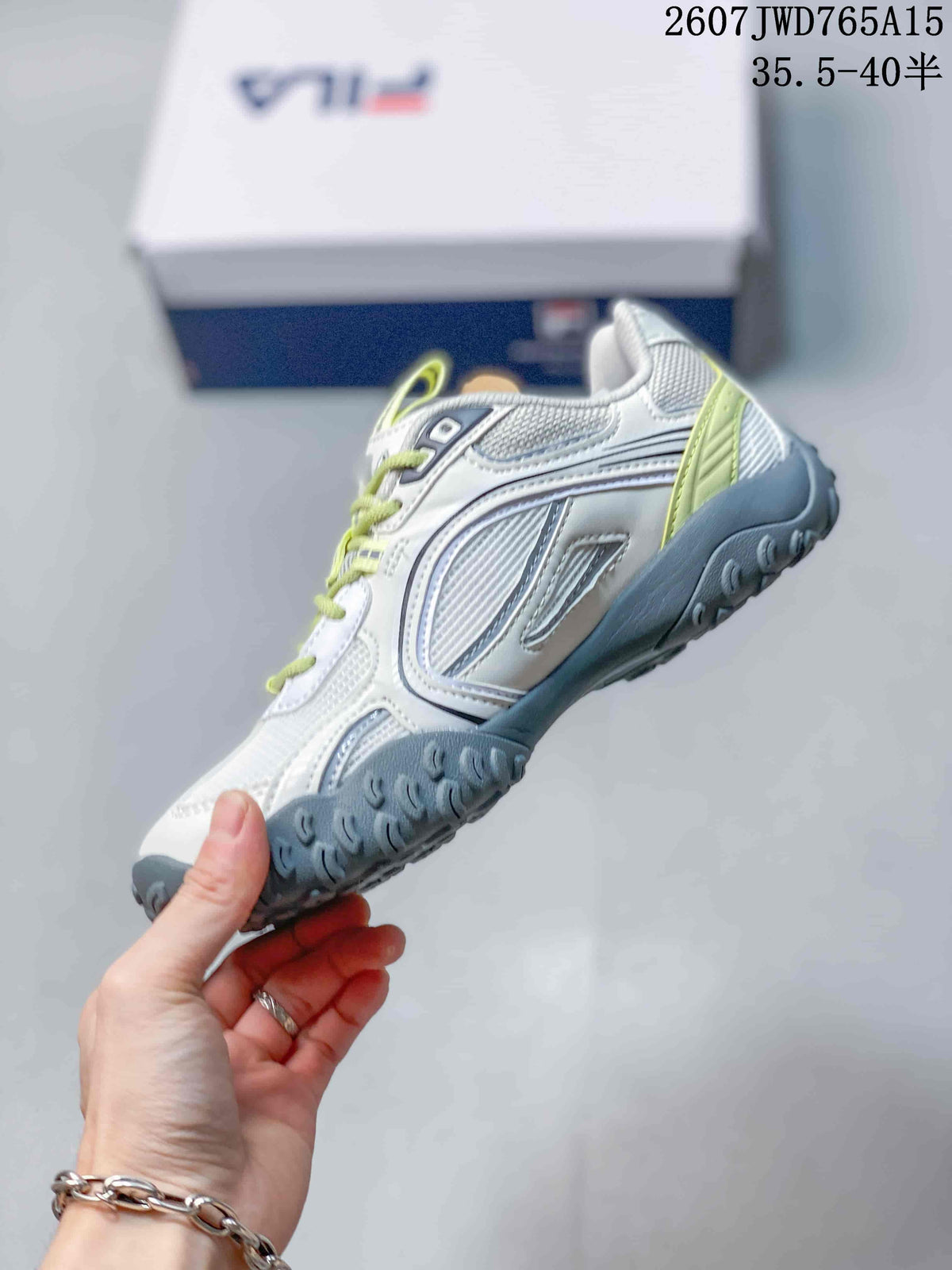 Side profile showing the layered upper, side branding and gray outsole