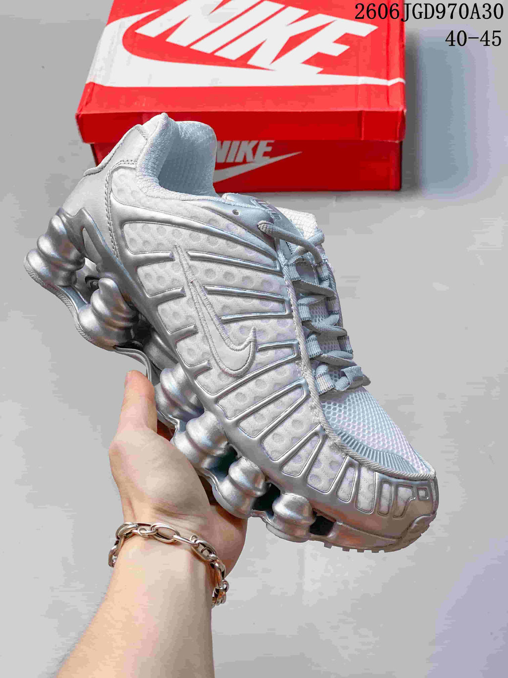 Silver Nike Shox TL sneaker with matching silver details