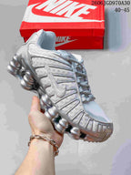 Silver Nike Shox TL sneaker with matching silver details