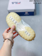 Underside view of a FILA sneaker showing the translucent textured outsole and tread pattern.
