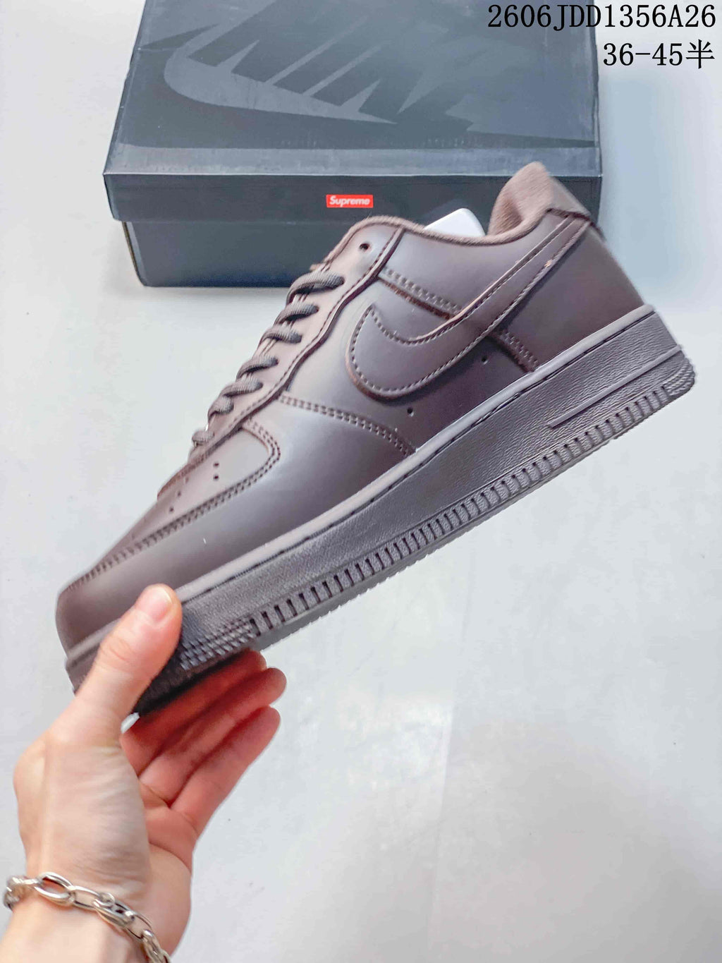 Side view of the brown low-top sneaker with a tonal Swoosh and matching sole